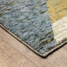5' X 7' Gold Blue Green Rust Beige Purple And Teal Geometric Power Loom Stain Resistant Area Rug