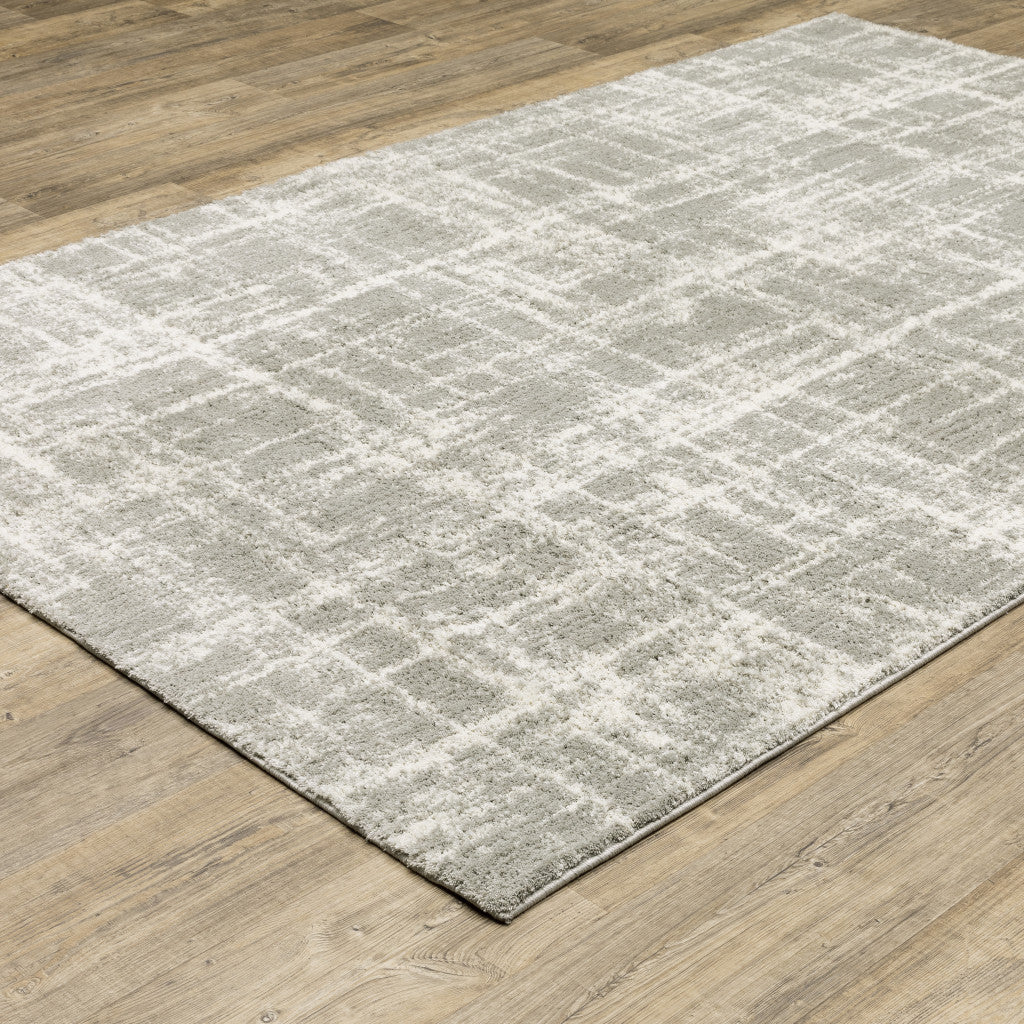 10' X 13' Grey And Ivory Abstract Shag Power Loom Stain Resistant Area Rug