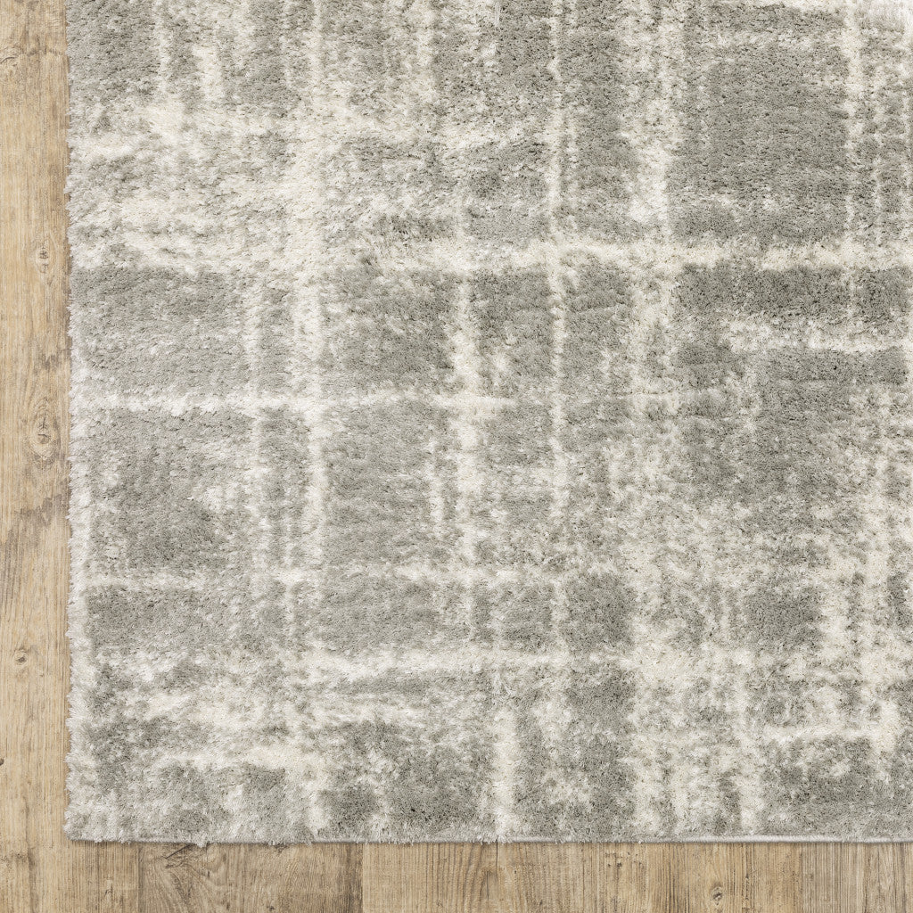 10' X 13' Grey And Ivory Abstract Shag Power Loom Stain Resistant Area Rug