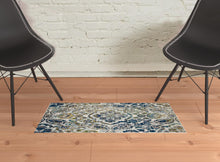 4' X 6' Ivory Blue And Green Floral Stain Resistant Area Rug