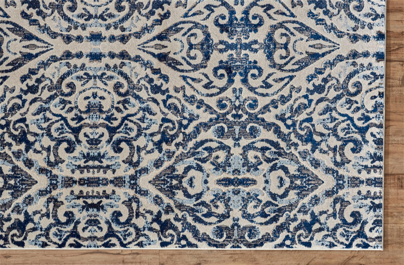 Blue Ivory And Black Floral Distressed Stain Resistant Area Rug - 2' X 4'