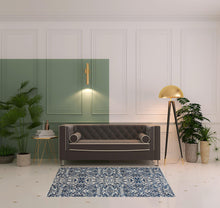 Blue Ivory And Black Floral Distressed Stain Resistant Area Rug - 2' X 4'