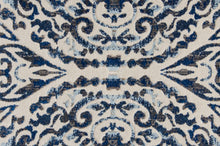 Blue Ivory And Black Floral Distressed Stain Resistant Area Rug - 2' X 4'