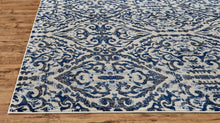 Blue Ivory And Black Floral Distressed Stain Resistant Area Rug - 2' X 4'