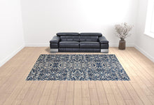 Blue Ivory And Black Floral Distressed Stain Resistant Area Rug - 2' X 4'