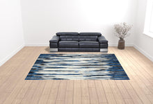 2' X 4' Ivory Blue And Gray Abstract Distressed Area Rug