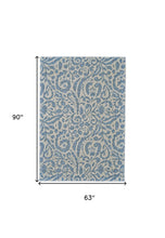 2' X 4' Blue Ivory And Tan Floral Distressed Stain Resistant Area Rug