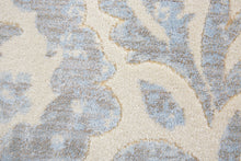 2' X 4' Blue Ivory And Tan Floral Distressed Stain Resistant Area Rug