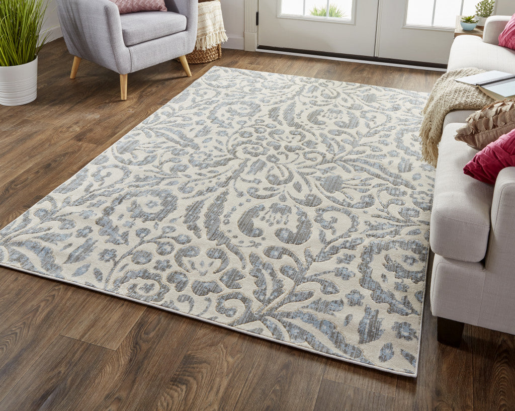 2' X 4' Blue Ivory And Tan Floral Distressed Stain Resistant Area Rug