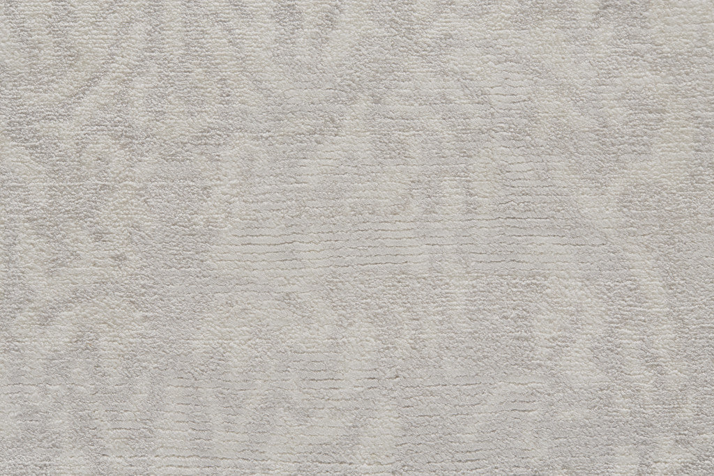 5' X 8' Ivory Gray And Tan Abstract Hand Woven Area Rug