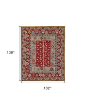 5' X 8' Red Blue And Brown Wool Floral Hand Knotted Distressed Stain Resistant Area Rug With Fringe