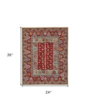 5' X 8' Red Blue And Brown Wool Floral Hand Knotted Distressed Stain Resistant Area Rug With Fringe