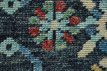 5' X 8' Blue Yellow And Red Wool Floral Hand Knotted Distressed Stain Resistant Area Rug With Fringe