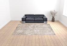 5' X 8' Brown And Ivory Abstract Stain Resistant Area Rug