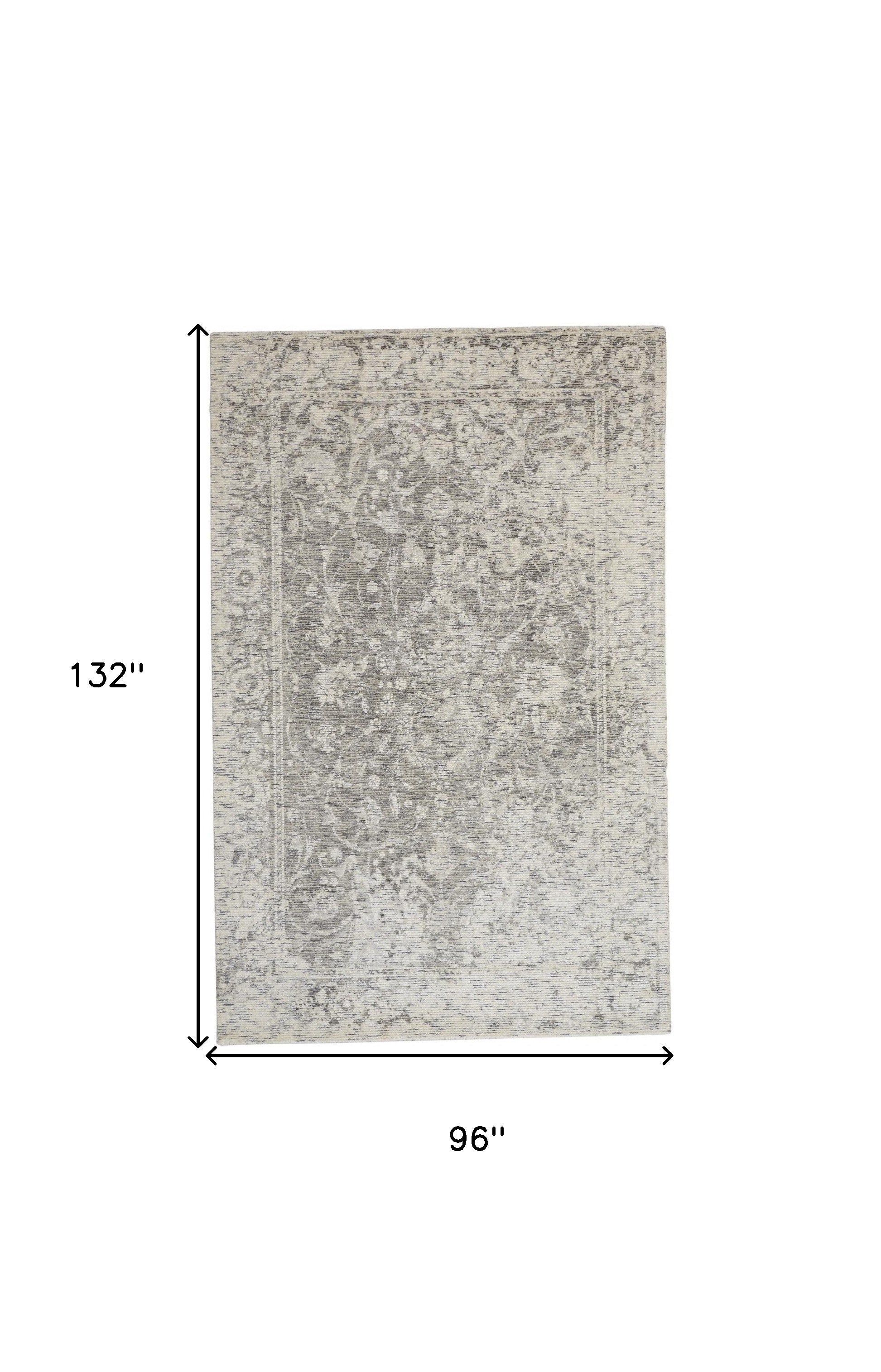 5' X 8' Ivory And Tan Abstract Hand Woven Area Rug