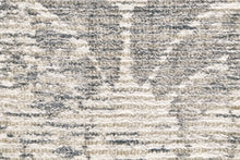 5' X 8' Ivory And Tan Abstract Hand Woven Area Rug