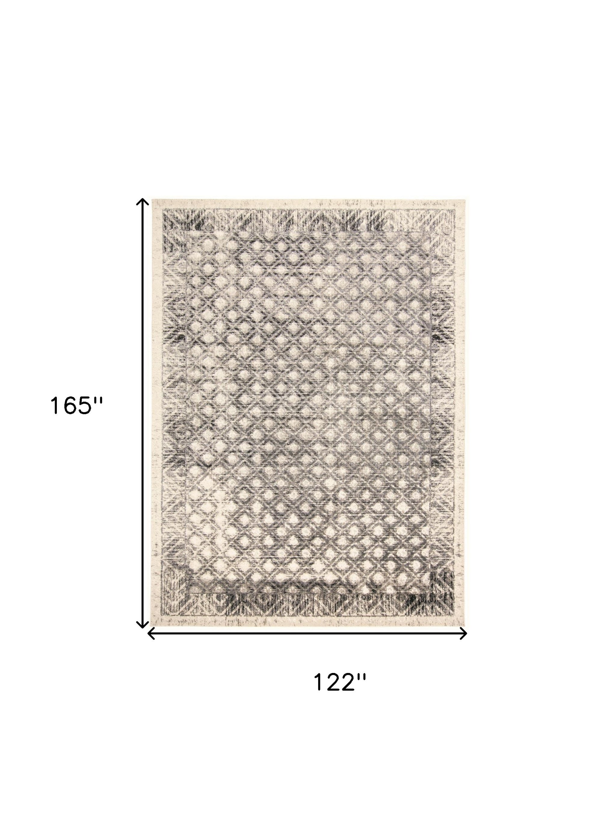 4' X 6' Ivory Black And Taupe Abstract Stain Resistant Area Rug