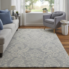 Blue And Ivory Wool Paisley Tufted Handmade Stain Resistant Area Rug - 5' x 8'