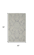 Blue And Ivory Wool Paisley Tufted Handmade Stain Resistant Area Rug - 5' x 8'