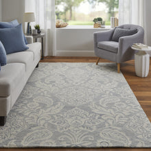 Blue And Ivory Wool Paisley Tufted Handmade Stain Resistant Area Rug - 5' x 8'