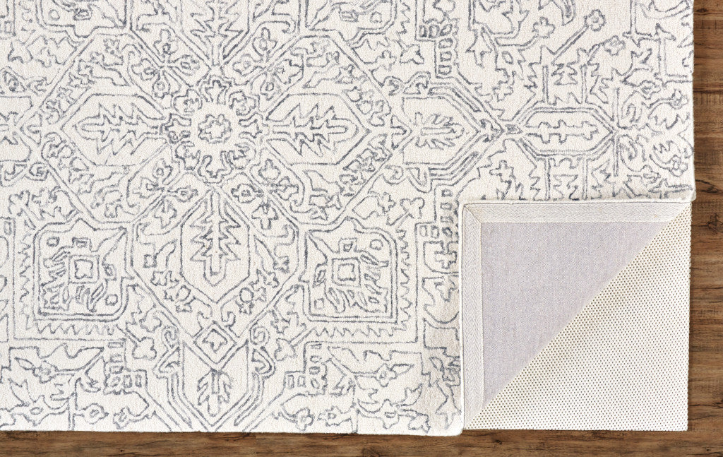 Ivory And Brown Wool Floral Tufted Handmade Stain Resistant Area Rug - 5' x 8'