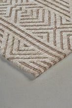 4' X 6' Tan Ivory And Brown Geometric Stain Resistant Area Rug