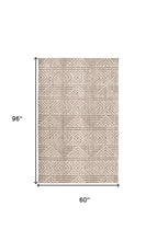 4' X 6' Tan Ivory And Brown Geometric Stain Resistant Area Rug