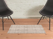 4' X 6' Tan Ivory And Brown Geometric Stain Resistant Area Rug