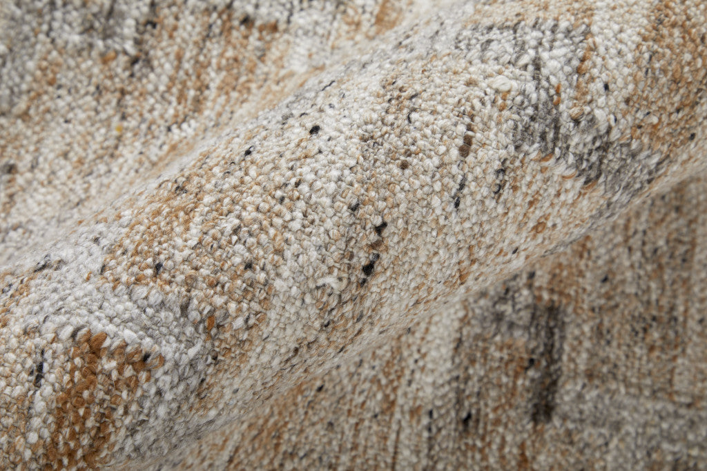 5' X 8' Tan Gray And Ivory Geometric Hand Woven Stain Resistant Area Rug With Fringe