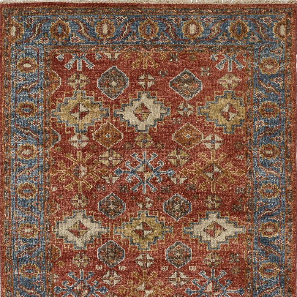 4' X 6' Red Blue And Orange Wool Floral Hand Knotted Stain Resistant Area Rug With Fringe