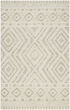 Ivory And Tan Wool Geometric Tufted Handmade Stain Resistant Area Rug - 4' x 6'