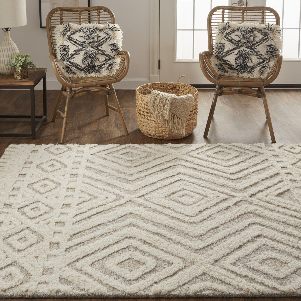 Ivory And Tan Wool Geometric Tufted Handmade Stain Resistant Area Rug - 4' x 6'