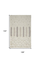 Ivory Taupe And Tan Wool Geometric Tufted Handmade Stain Resistant Area Rug - 4' x 6'