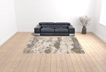 4' X 6' Gray Ivory And Gold Abstract Area Rug