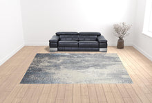 4' X 6' Gray Blue And Ivory Abstract Area Rug
