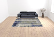 4' X 6' Blue Green And Ivory Abstract Power Loom Distressed Area Rug