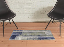 4' X 6' Blue Green And Ivory Abstract Power Loom Distressed Area Rug