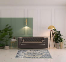 4' X 6' Ivory And Blue Floral Power Loom Distressed Area Rug