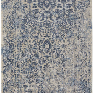 4' X 6' Blue And Ivory Floral Power Loom Distressed Area Rug