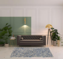 4' X 6' Blue And Ivory Floral Power Loom Distressed Area Rug