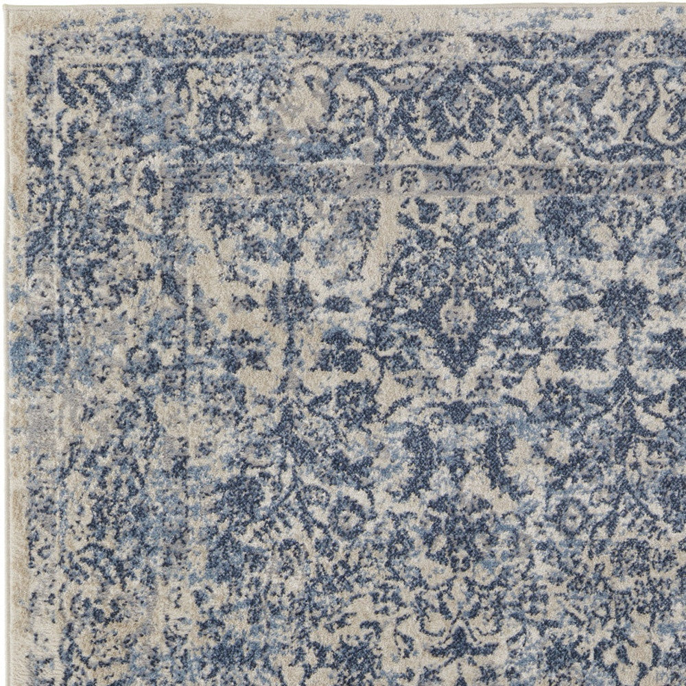 4' X 6' Blue And Ivory Floral Power Loom Distressed Area Rug