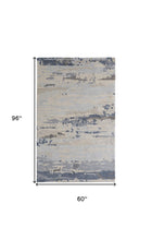 Blue Gray And Ivory Wool Abstract Tufted Handmade Stain Resistant Area Rug - 4' x 6'