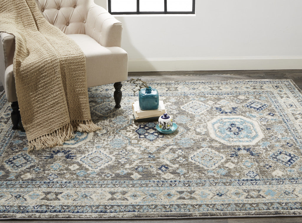 5' X 8' Gray Brown And Blue Floral Stain Resistant Area Rug