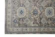 5' X 8' Gray Brown And Blue Floral Stain Resistant Area Rug