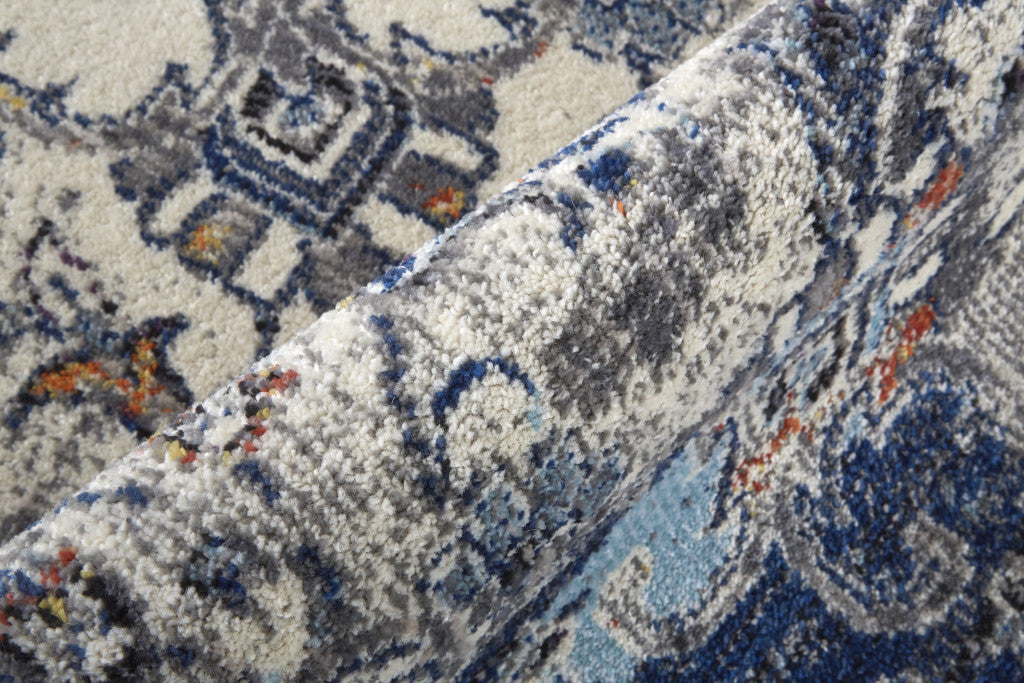 5' X 8' Ivory Gray And Blue Floral Power Loom Distressed Stain Resistant Area Rug