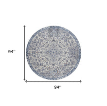 5' X 8' Ivory Gray And Blue Floral Power Loom Distressed Stain Resistant Area Rug