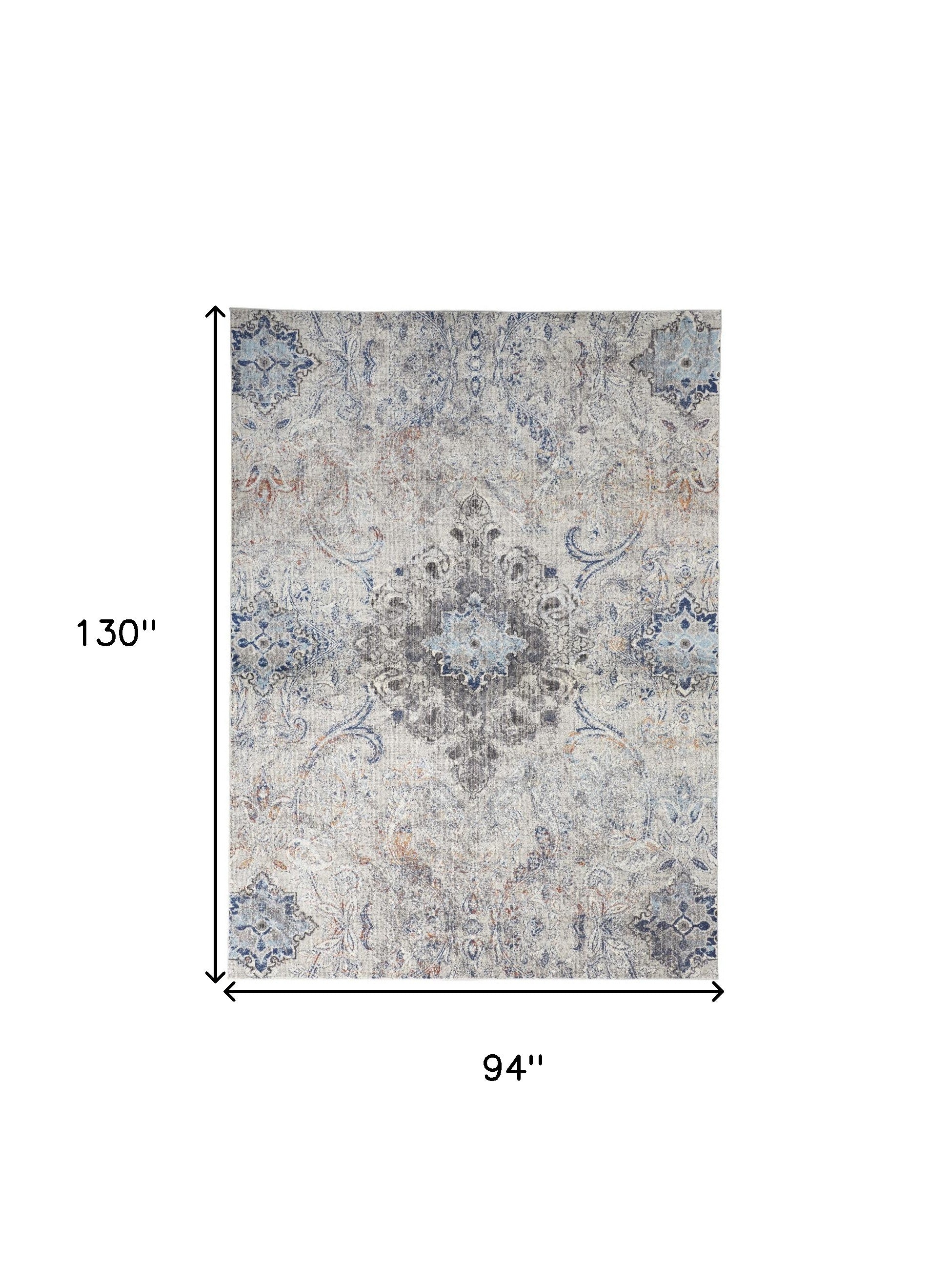 5' X 8' Ivory Taupe And Blue Floral Power Loom Distressed Stain Resistant Area Rug