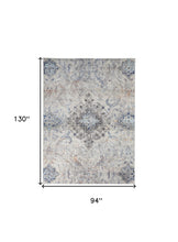 5' X 8' Ivory Taupe And Blue Floral Power Loom Distressed Stain Resistant Area Rug