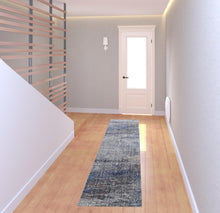 5' X 8' Taupe Blue And Ivory Abstract Power Loom Distressed Stain Resistant Area Rug