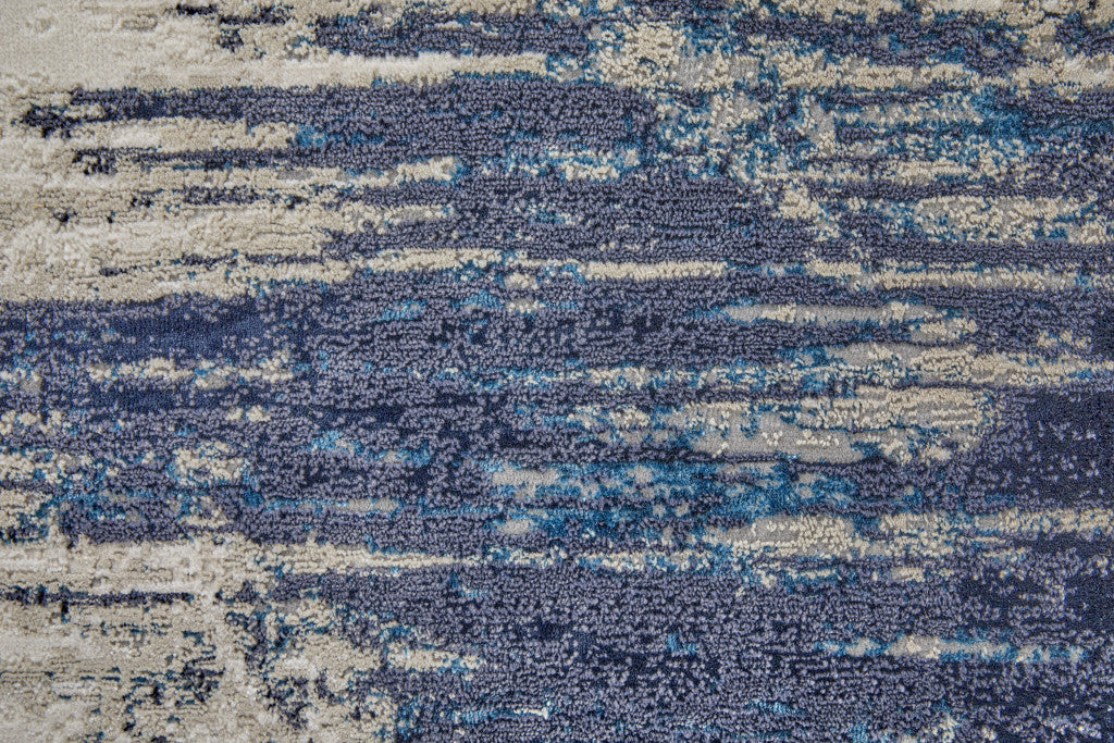 4' X 6' Tan Blue And Ivory Abstract Power Loom Distressed Area Rug